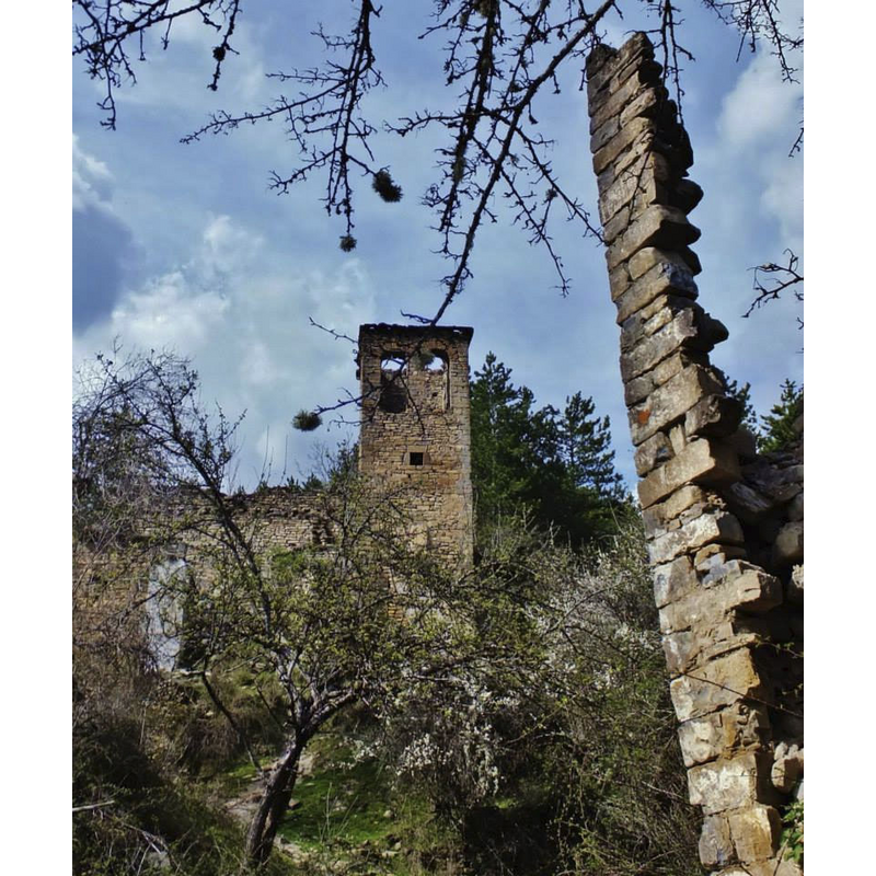 the church in the context of the ruins of the abandoned village