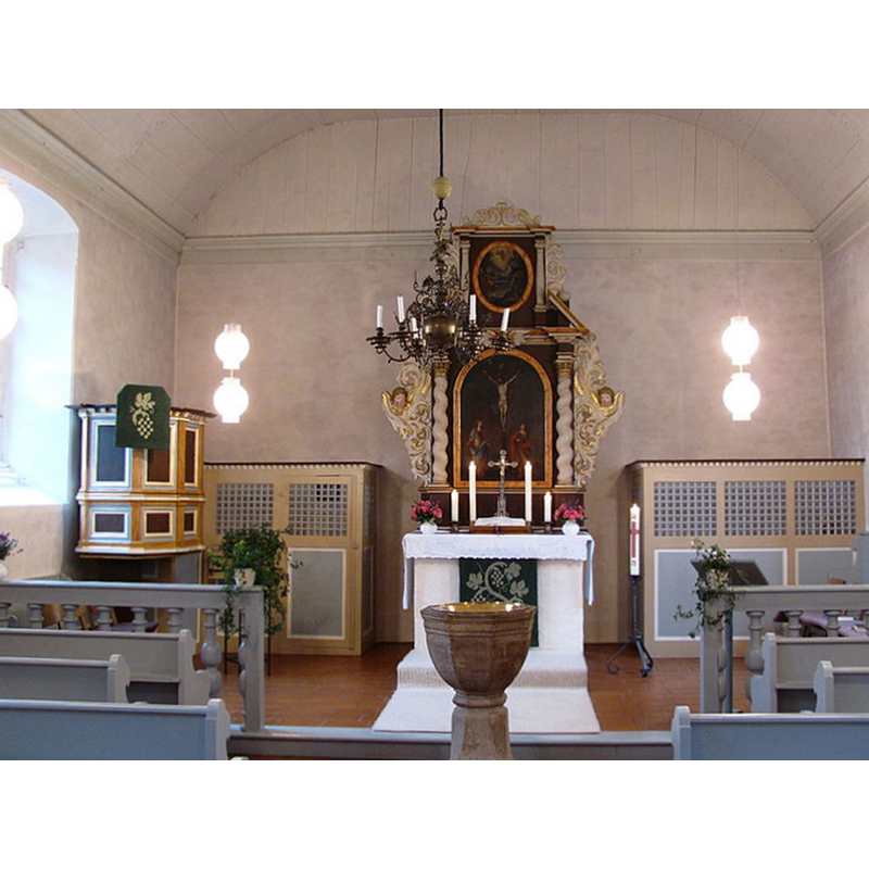 the font at the east end of the nave, just west of the communion railing