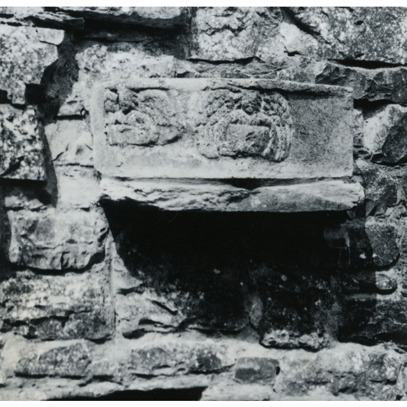 Photo caption: "Piece of font in N[orth]. wall"