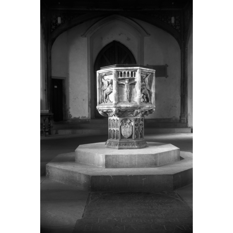 Photo caption: "Early 15c font with crucifixion, and symbols and emblems of passion on bowl"