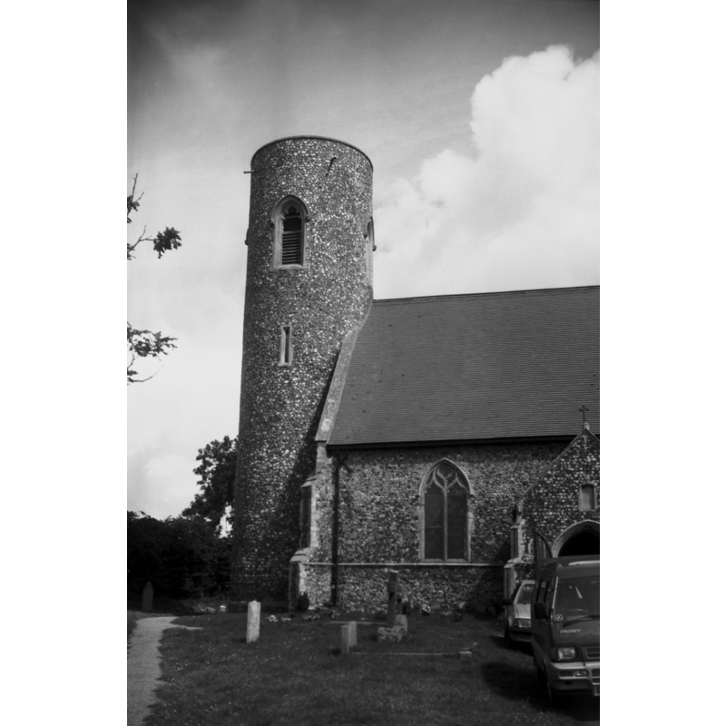 Photo caption: "Re-faced round tower"