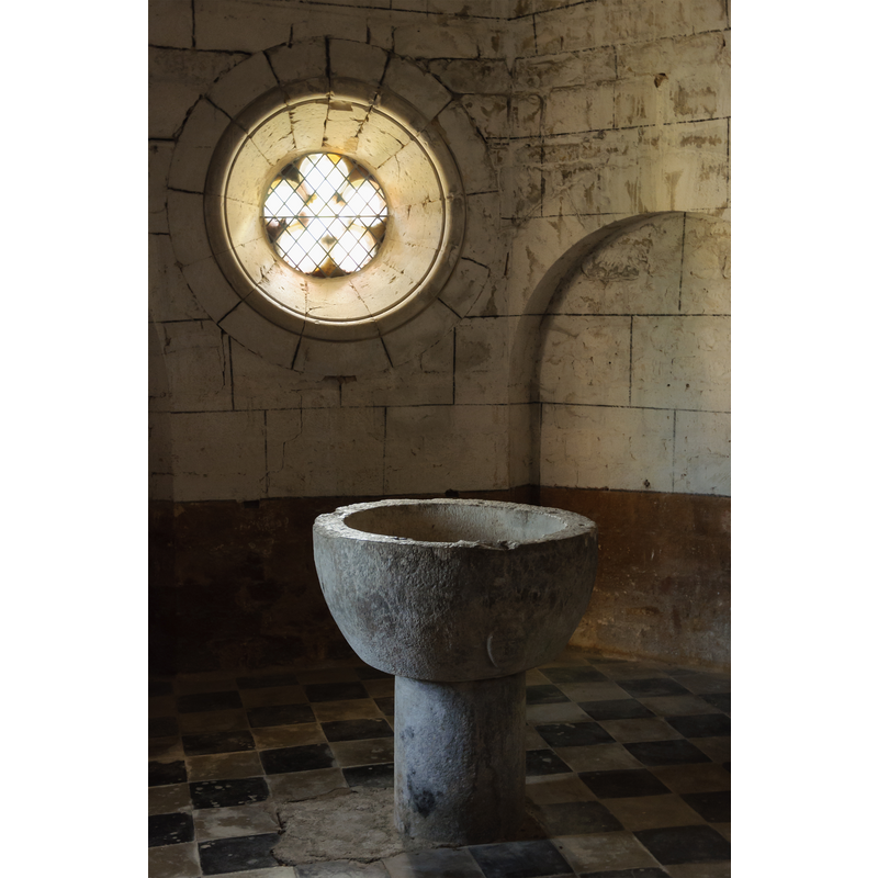 with the medieval font in it; the round window is on the east wall