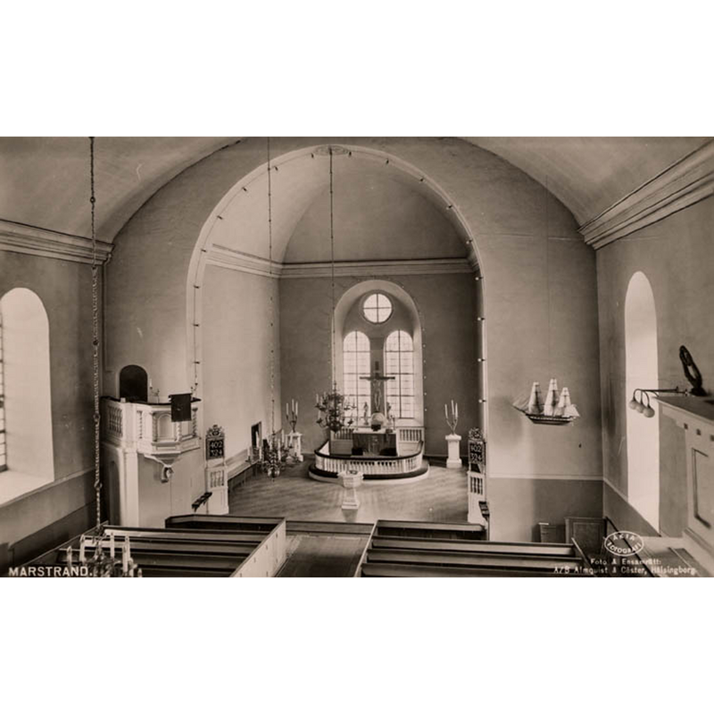probably taken from the west gallery -- the modern font in the centre of the chancel