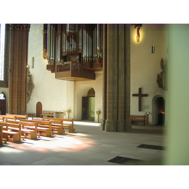 the re-built interior with the modern (1957) font at the west end of the nave