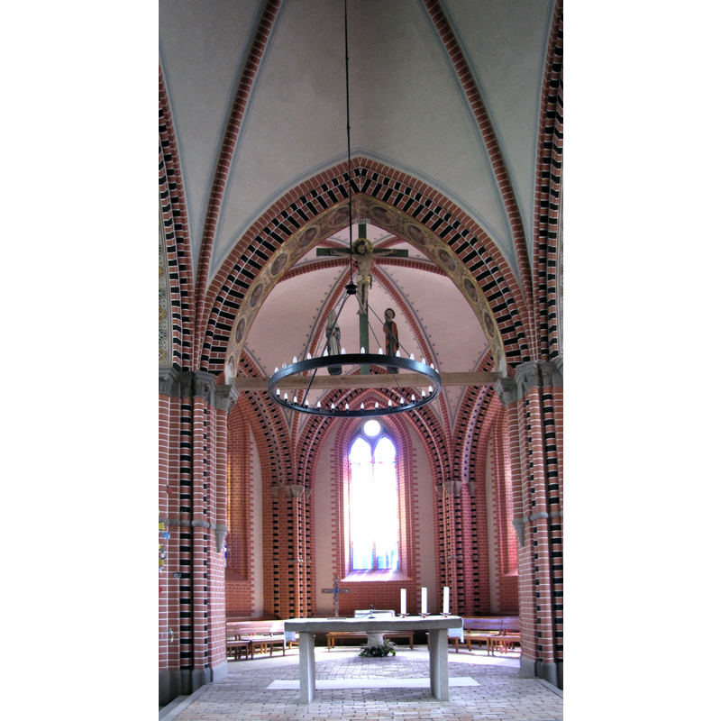 the old font is visible behind the modern altar