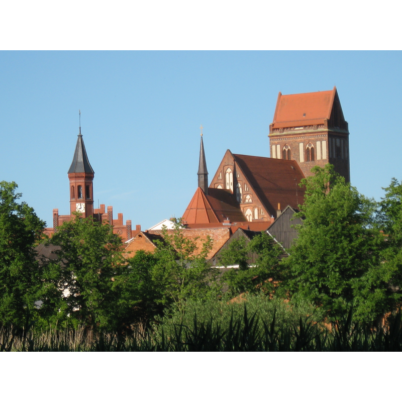 the tower on the left belongs to the nearby town hall