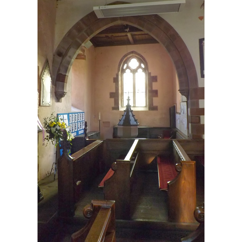 the modern font is located in a chapel protruding on the south side (not really a transept)