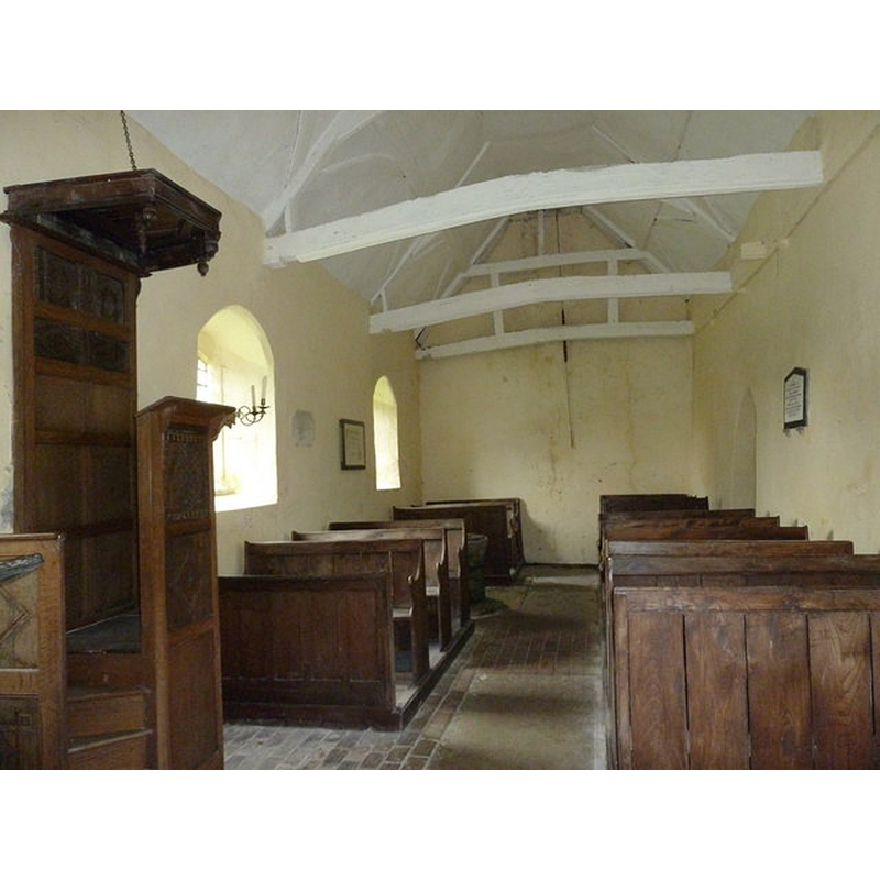 the font is partially visible on the left [south] side, behind the third pew