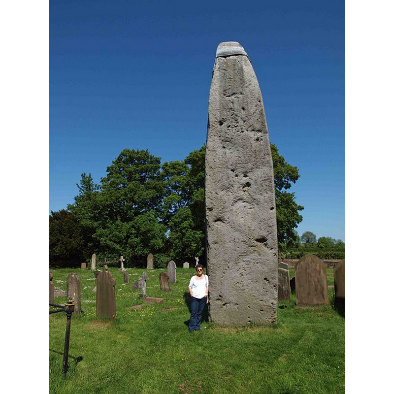 Photo caption: "Rudston monolith. In the Church (All Saints) Yard Rudston. Approximately 8m above ground it is Britain’s tallest standing stone. It’s weight is estimated at 40 tonnes. In the late 18th century tests revealed that there is as much again of the stone buried in the ground. dating from 2000 BC the stone is believed to come from near Whitby".