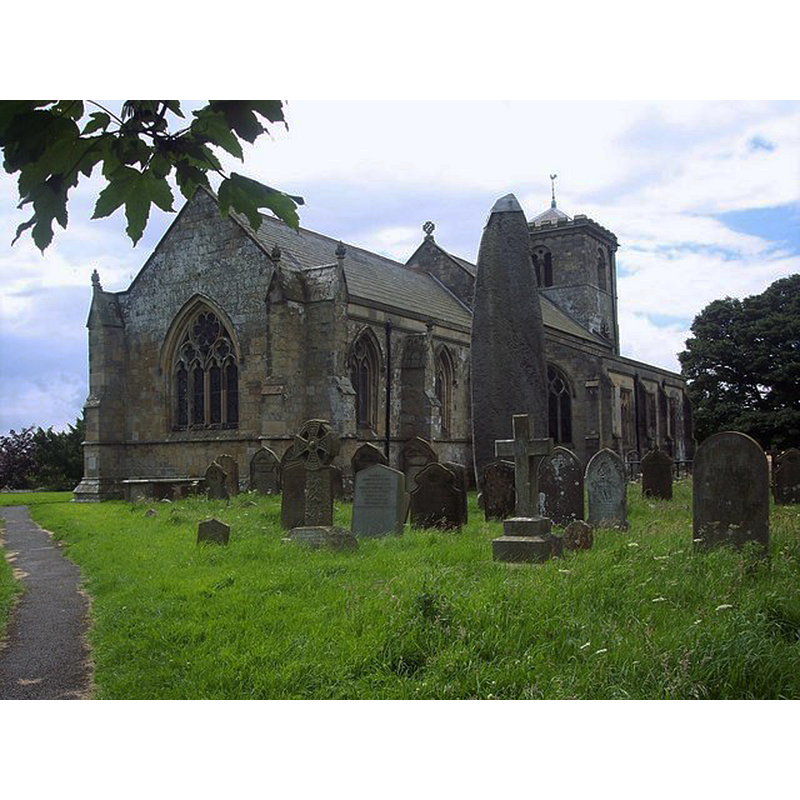 Photo caption: "All Saints Church and Monolith, Rudston. Over 25' high [8 m], this Bronze Age stone is the largest monolith in Britain, and was probably a pagan worship monument."