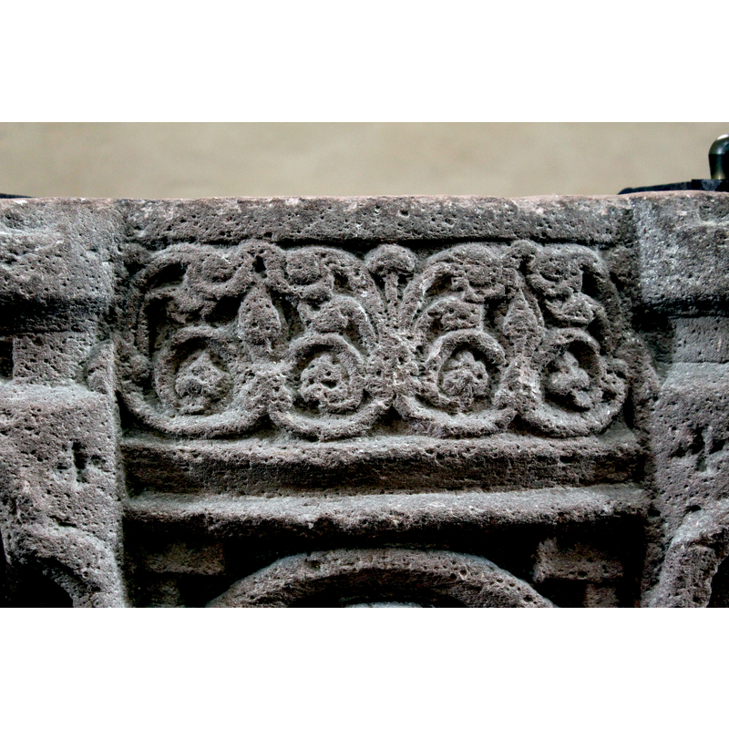 on the upper panels, between the protruding sides