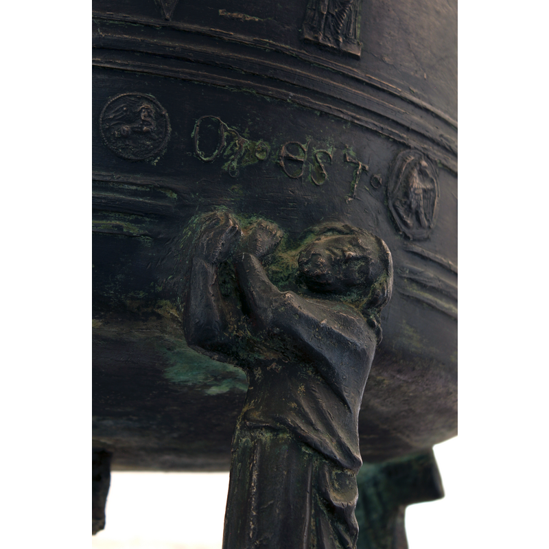 both hands supporting the font