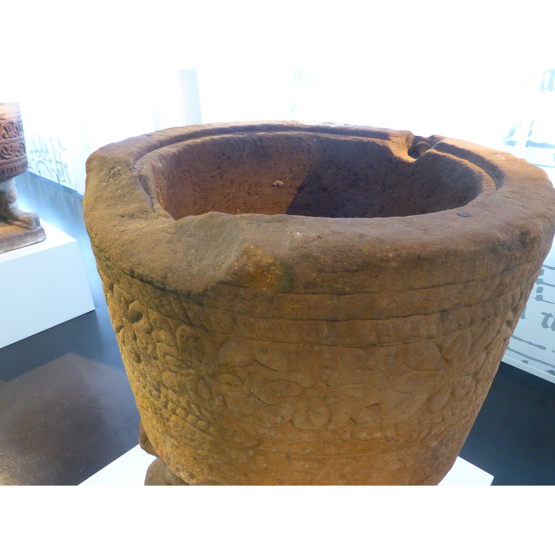 the tapering of the basin is appears exaggerated by lens distortion; the basin is in fact almost cylindrical