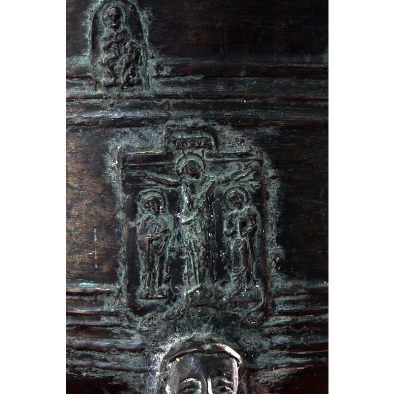 Inscription on cross reads IESVS, not INRI; two other persons in the scene could be Mary (left) and John with book (right)
