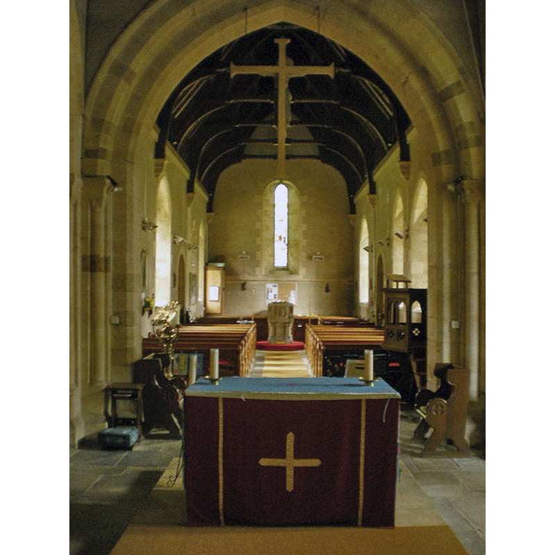 the modern font is visible at the west end of the nave