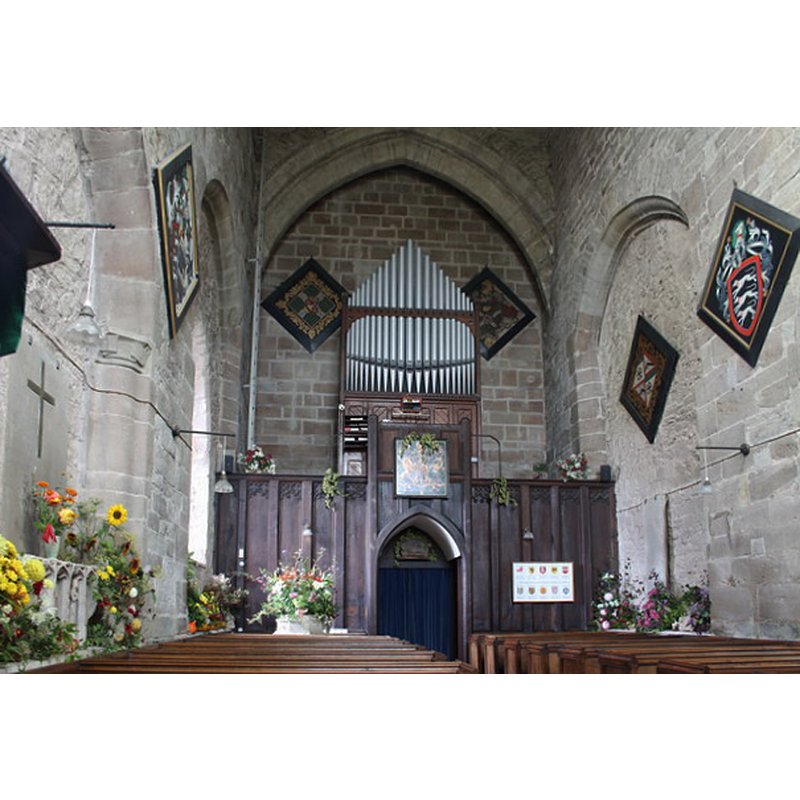 the top of the font is partially visible at the far end [west], left [south] side, with a floral arrangement on the top