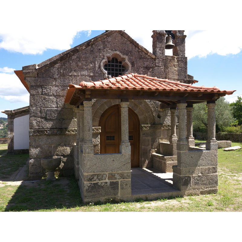 notice the old font at the front, to the left of the porch
