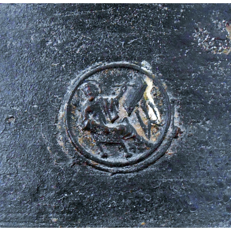no discernible symbol found to identify the haloed figure seated at a writing desk