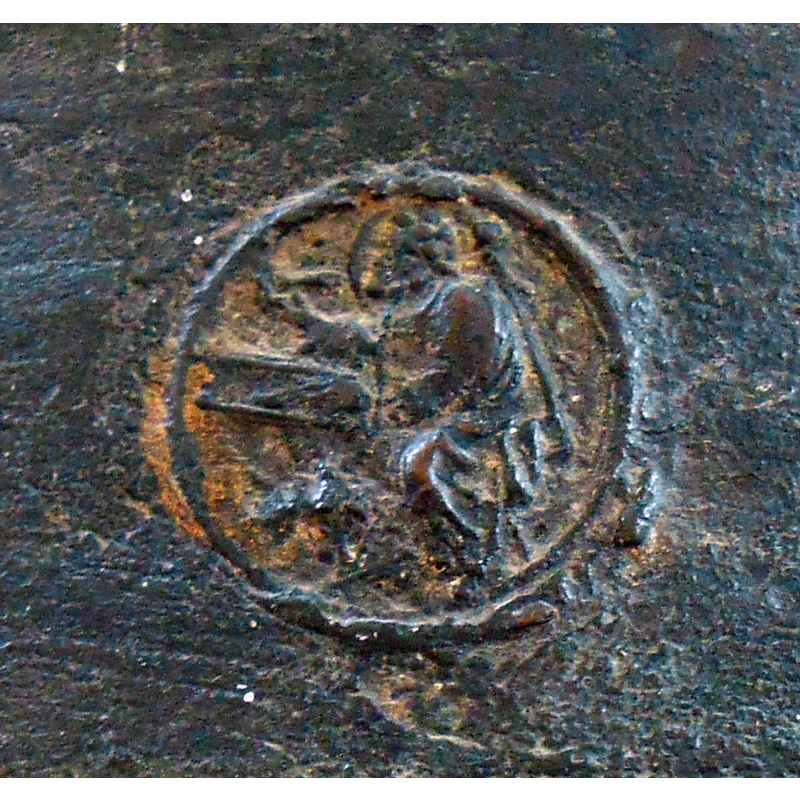 no discernible symbol found to identify the haloed figure seated at a writing desk
