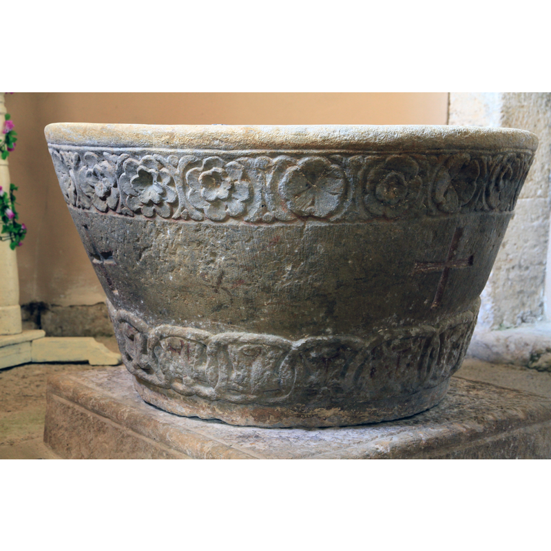 at opposite sides of the basin; these crosses may have been carved later