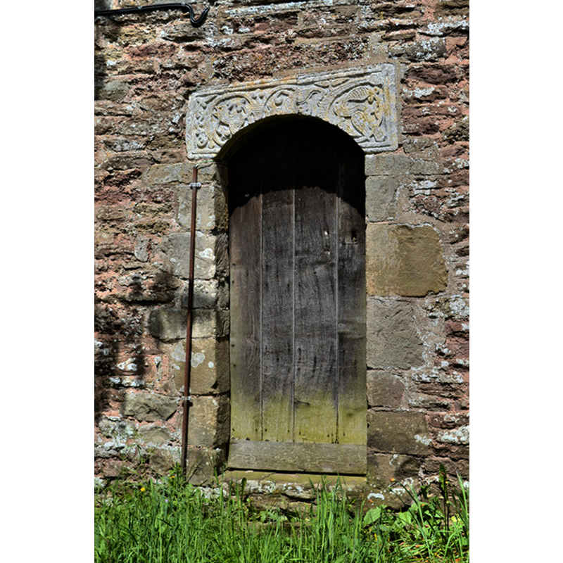 Source caption: "St Giles, Acton Beauchamp. The tower doorway, with part of a 9th century cross as a lintel."