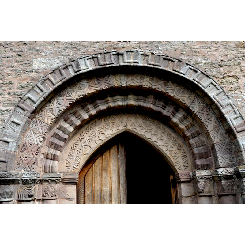 Source caption: "Norman arch over the main door to St Peter's church, Bromyard."