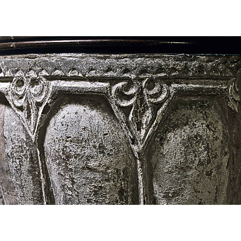 in the spandrels created by the ribbed panels around the basin