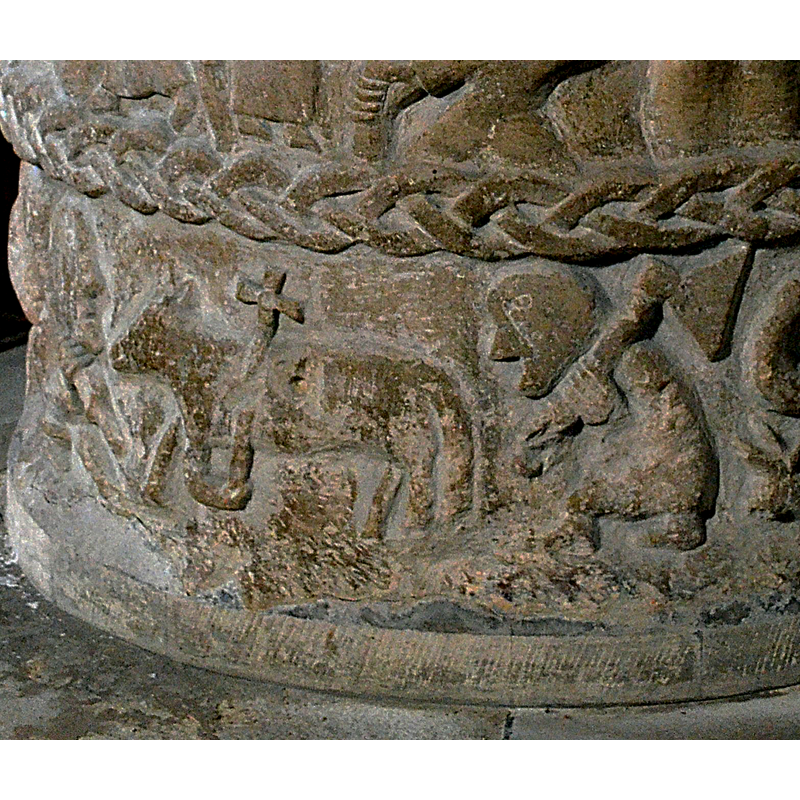 FIRST SCENE ON LOWER REGISTER. Lower register separated by a braid. Under the mandorla, the Agnus Dei facing left -- on the south side of the basin [NB: orientation is approximate]