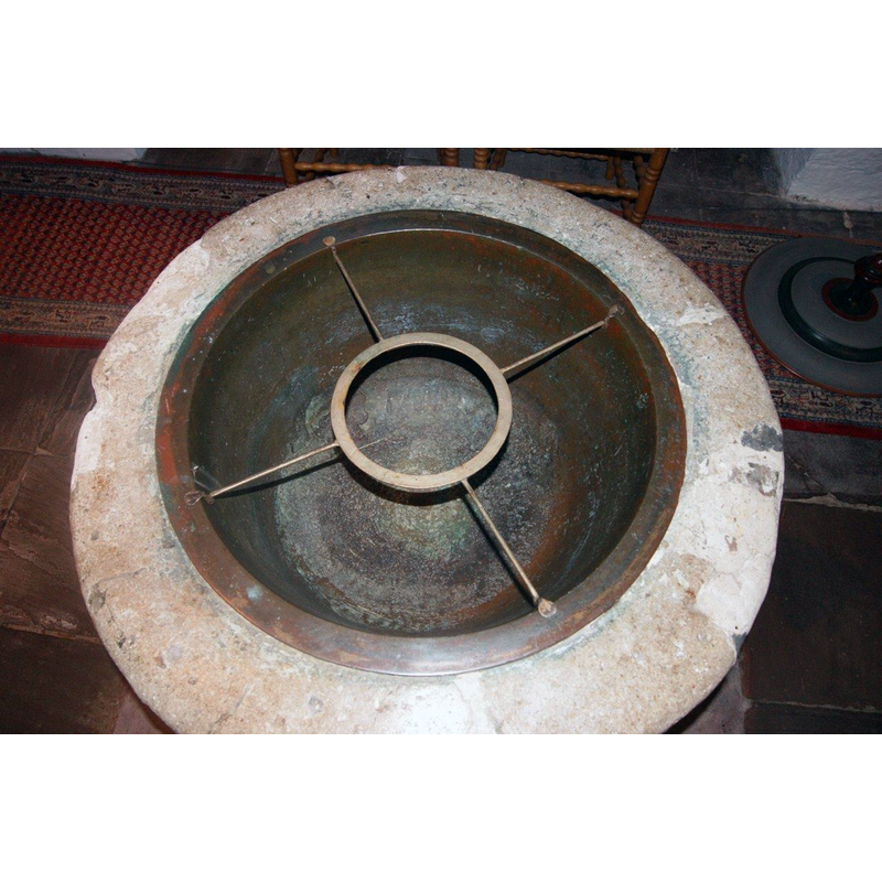 the view of the metal insert or lining [NB: the photographer had no access to the inside of the stone well]