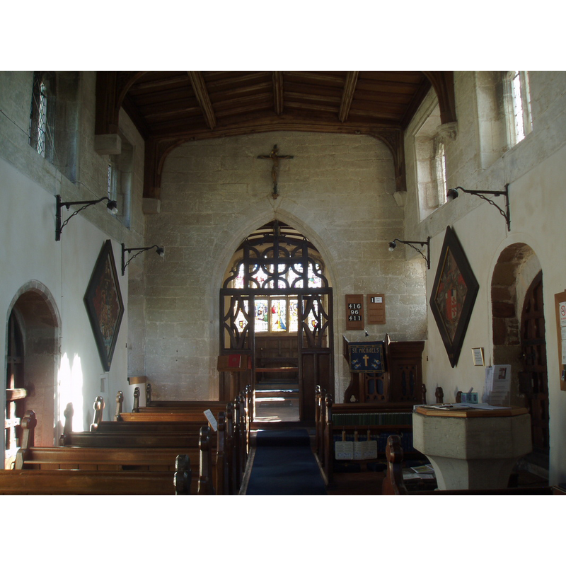 in the nave, at the west end, south side