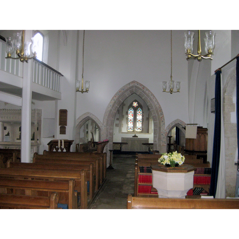 the upper half of the font and its cover are visible in the foreground, right side [west end of the nave, south side]