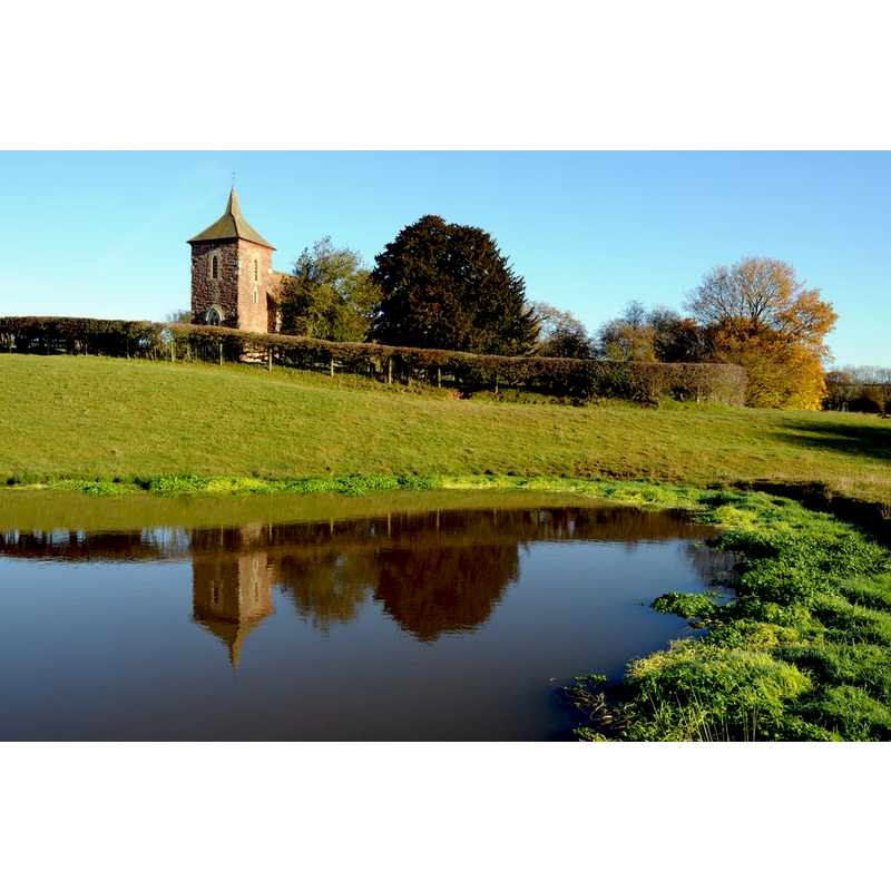 Source caption: "The church which is dedicated to St John the Baptist and dates from 1787-1788 and like many churches underwent some Victorian restoration; it is a grade II listed building. The church stands among fields with no road access and is no longer used as a church."