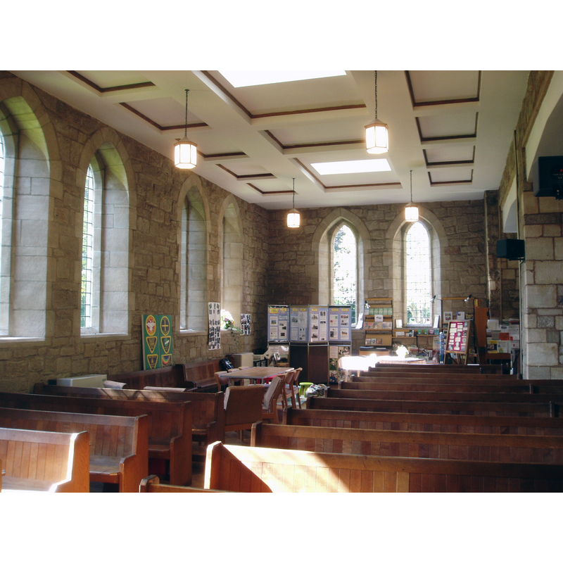 Source caption: "1950s Gothic at Chilvers Coton. All Saints church in Chilvers Coton (now a suburb, close to the centre of Nuneaton) suffered a direct hit during an air raid in 1941 and was largely demolished, leaving just the late medieval tower and fourteenth century chancel standing. After the War the old tower and shallow chancel were retained in the rebuilt church, which now boasts a new nave in 1950s gothic, which is largely successful and blends surprisngly well with the older parts of the building. Much of the rebuilding was done with the assisstance of former German prisoners of War in an act of reconciliation. Today the interior is light and airy, with it's spacious modern nave and clear glazed windows (all the previous stained glass was lost in the bombing, which sadly included some fourteenth century fragments in a chancel window). The old church was best known for it's association with local novelist George Eliot (Mary Ann Evans), who was baptised here in 1819 and attended services until the age of 21."
