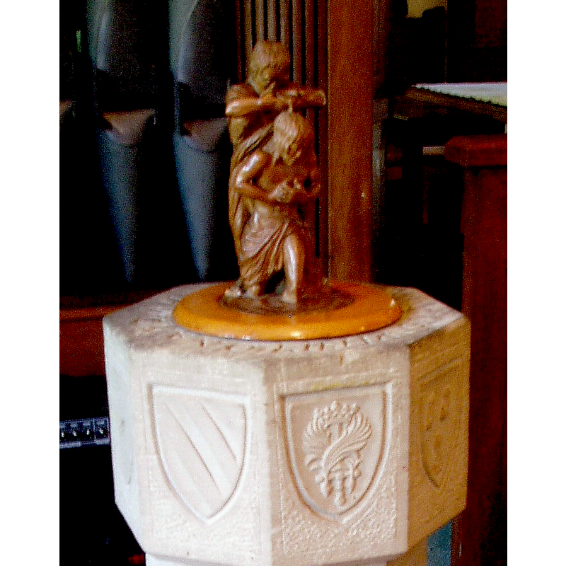 Source caption: "The cover has a small sculpture of the Baptism of Christ by Heinrich Schonmeyer".