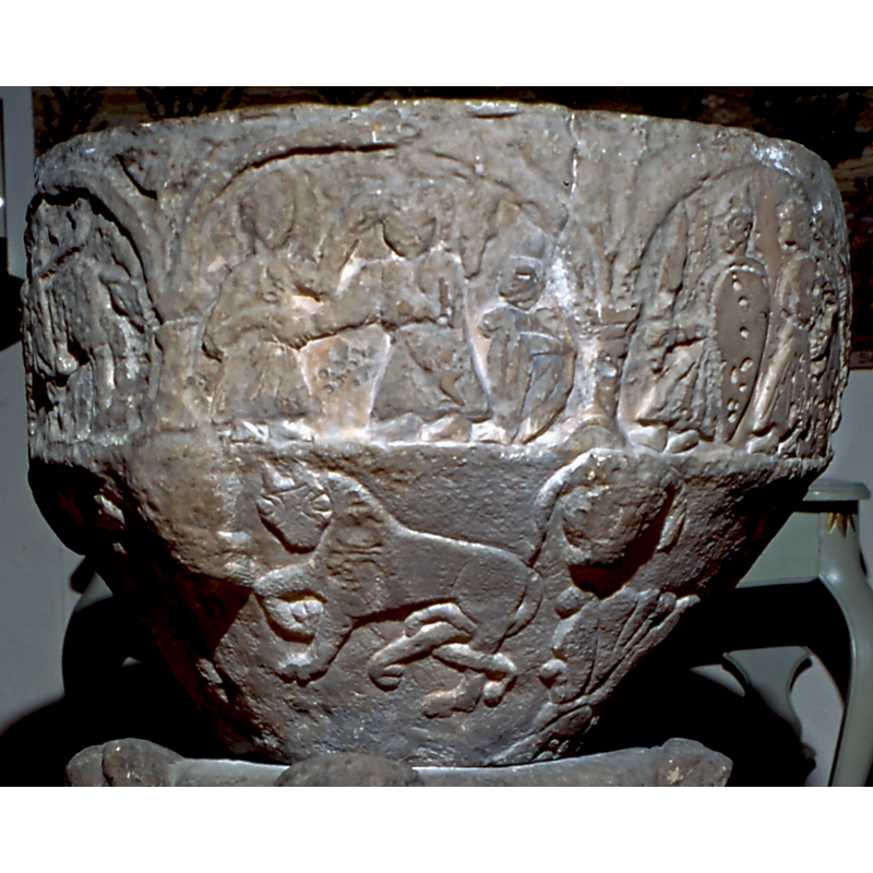 two figures engaged in the centre of the scene; a possible smaller figure in the right corner-- on the northwest side of the basin [orientation is approximate]