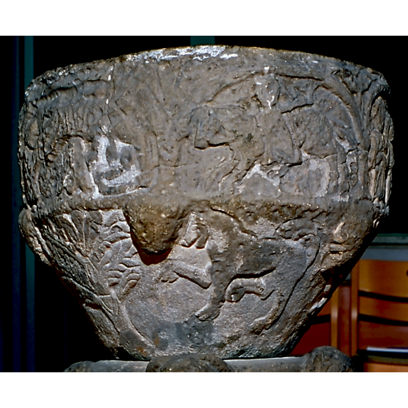 passant to the left; perhaps a horse -- on the east side of the underbowl [orientation is approximate]