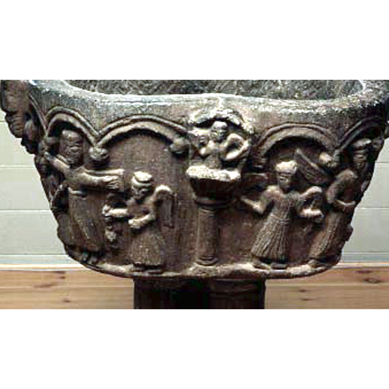 in one of the 'spandrels' or concave recesses of the quatrefoiled basin; the demi-figure angel appears to be in an orant position atop one of the columns of the arcade