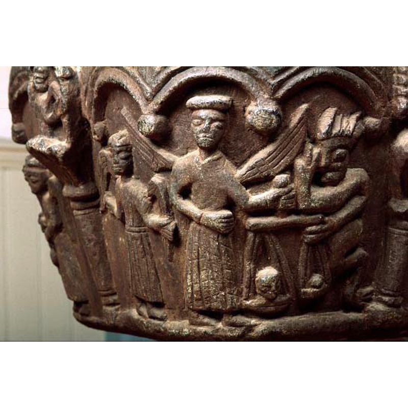 the composition includes three figures: on the left is an angel in an orant position; in the centre is a larger angel (St. Michael?) holding the scales that have souls on them (a large one on Michael's side, a small one on the opposite scale; at the right end is a semi-crouching devil interfering with the scales and giving a two-finger sign; the lower half of the devil's body is animal, with hooved extremities