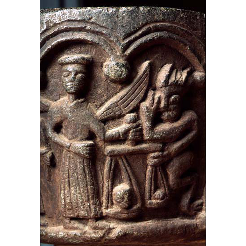 the devil on the right is quite active: its left hand is trying to weighd own the scale with smallest soul in it, while its right hand gives a two-finger sign (meaning?)