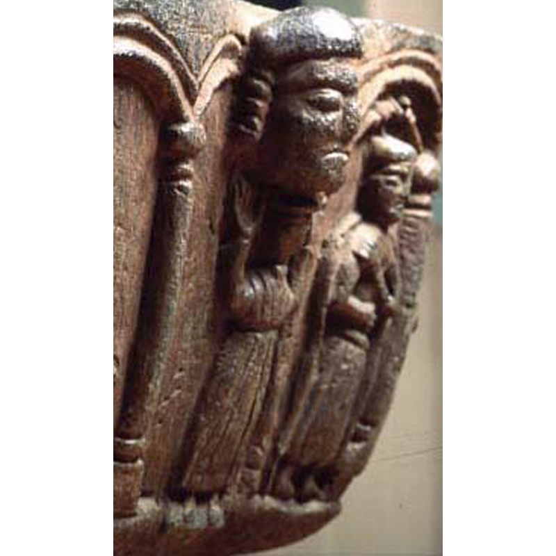 resembling the head in the previous spandrel, but not identical