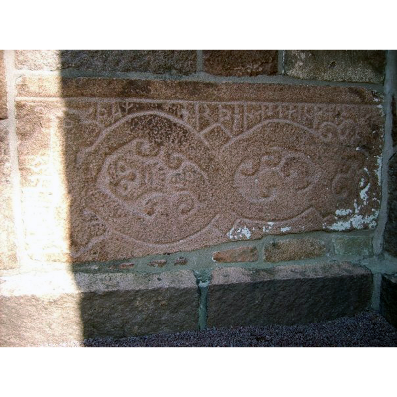 a Runic stone incorporated into the tower south wall of the 19th-century church here -- Source caption: "Runsten inmurad i Brastads nya kyrka från 1876, då den medeltida revs. Runorna lyder: "Jungfru Maria hjälpe den som gjorde denna sten"."