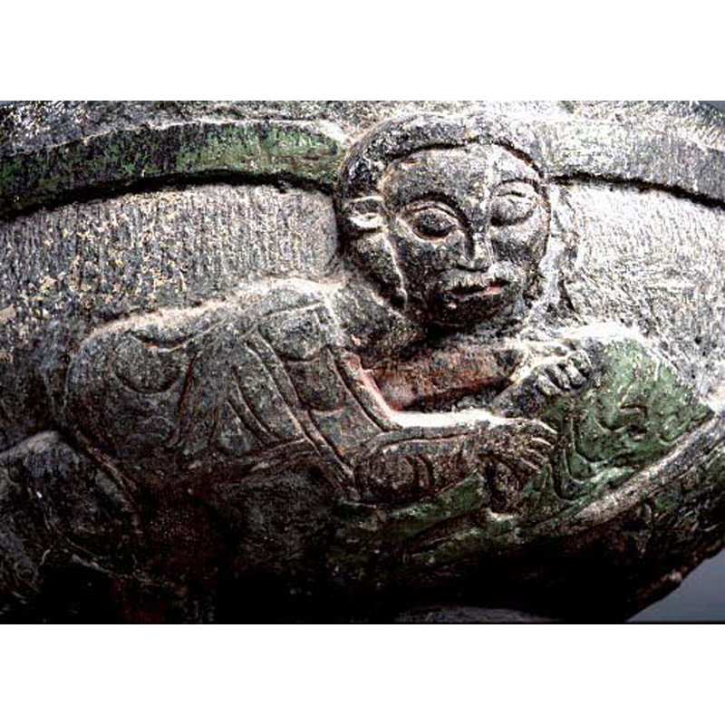 SHM's photo caption: "man som griper om lejonsvans", but the animal owner of the tail is looks like a manticore