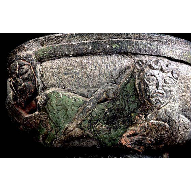 the head is human, but the left body is a lion's; its tail is being held in both hands of the large human figure on the left; there appears to be prey in its front paws -- SHM's photo caption reads: "bicorporates"