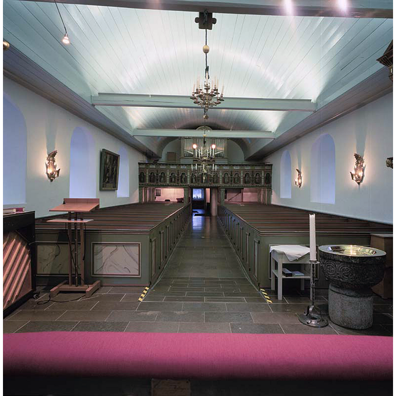 the old font in the poreground [east], right [south] side of the chancel