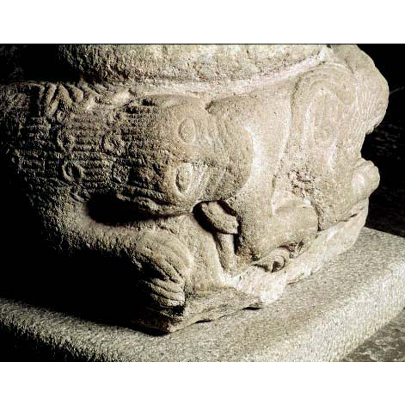 the lions of the base are either biting each other's rumps, or have human prey -- in this image the left appears to be a lion's mane and neck, but the head of the prey is human