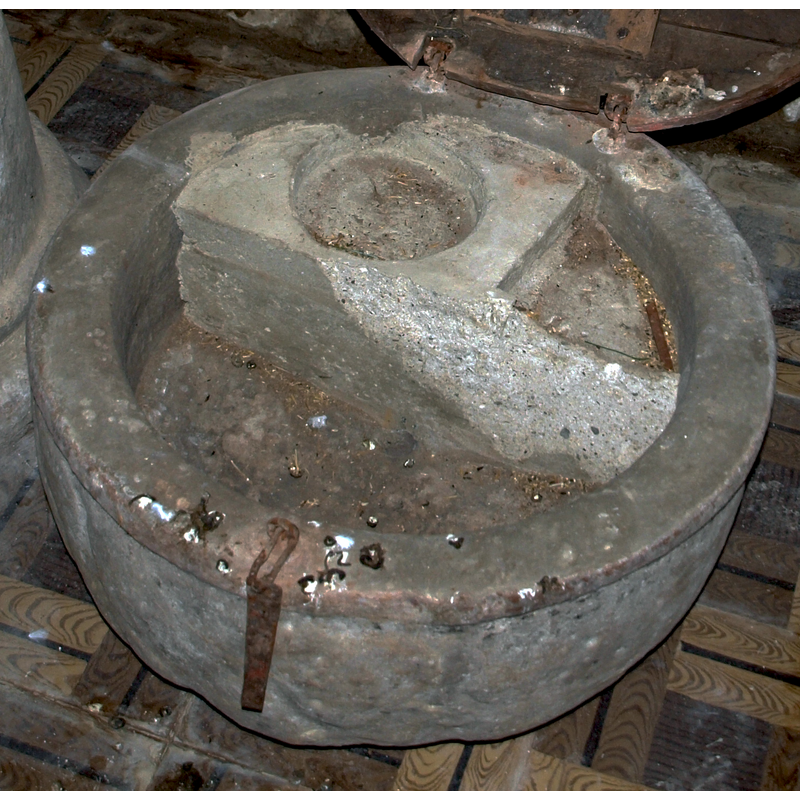 the partitioning of the inner basin is clearly not original, but a later addition -- notice the metal hasp of the cover still in place