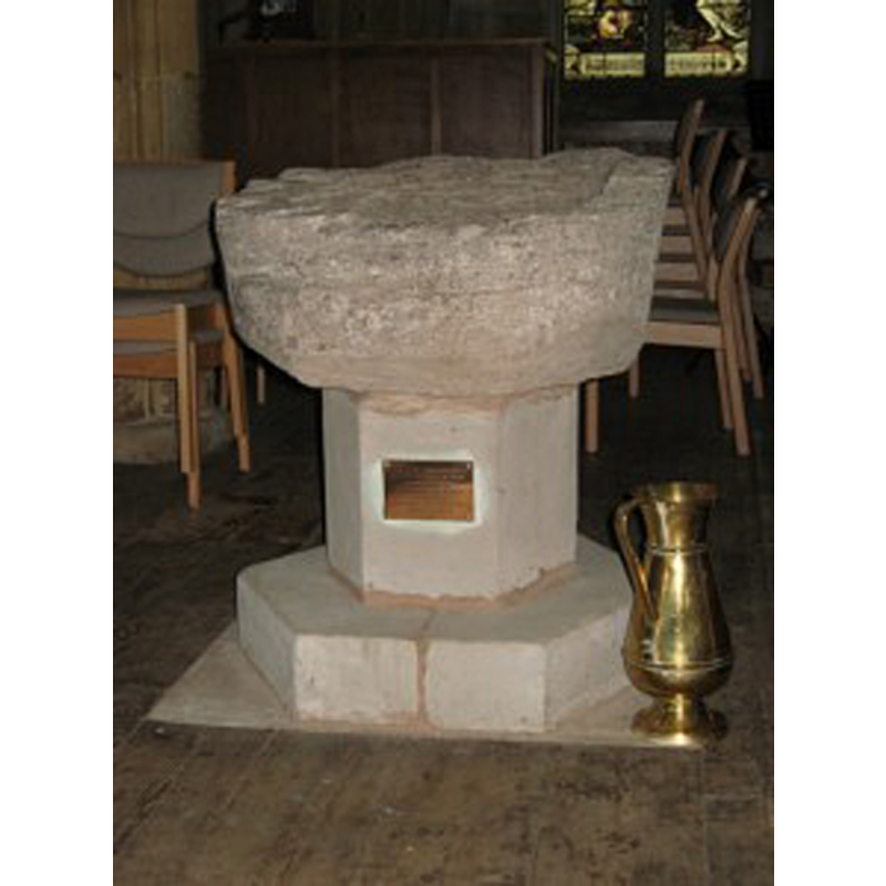 the fragment of the old basin now remounted on a modern pedestal base
