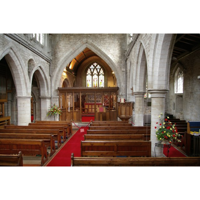Source caption: "Interior of St Mary's Church. The original, aisleless Norman church was greatly enlarged in the 14th century, when the Perpendicular clerestory was added. A remnant of one of the earlier Norman windows can be seen between the first two arches on the north (left) side."