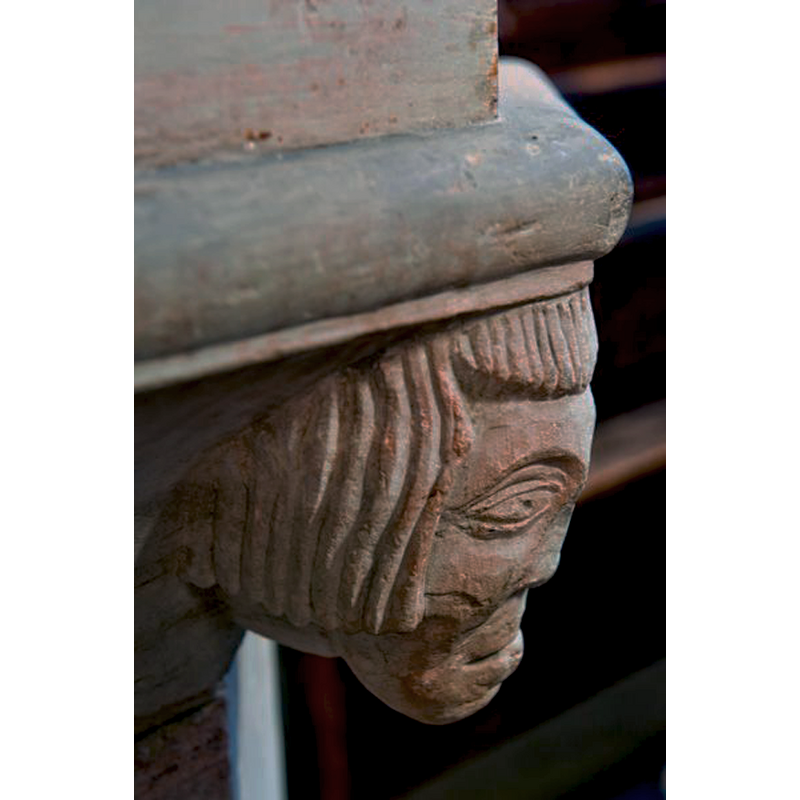 one of the heads at the angles of the underbowl