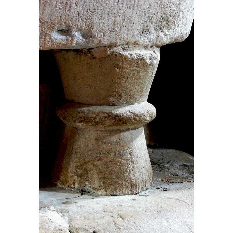 on one of the legs of the base